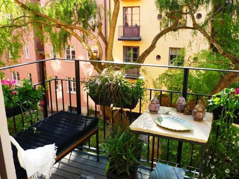 Hang some plants on the edge of the rooftop.